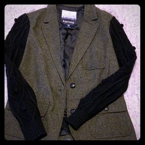 Army green blazer with black sweater sleeves